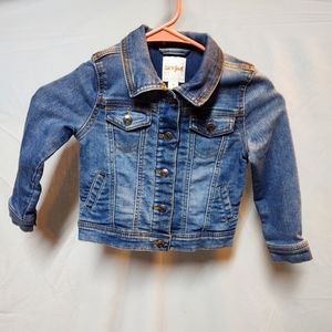 Little girls jean jacket. Blue denim, with snap buttons.